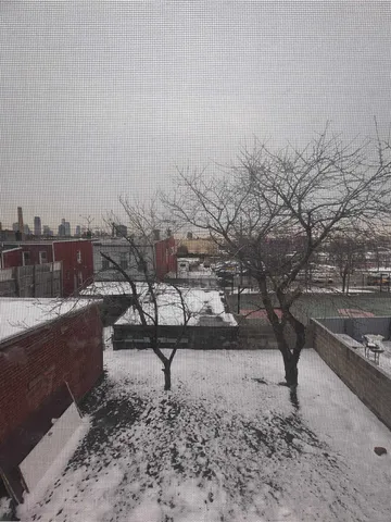 a view of a lake with a yard