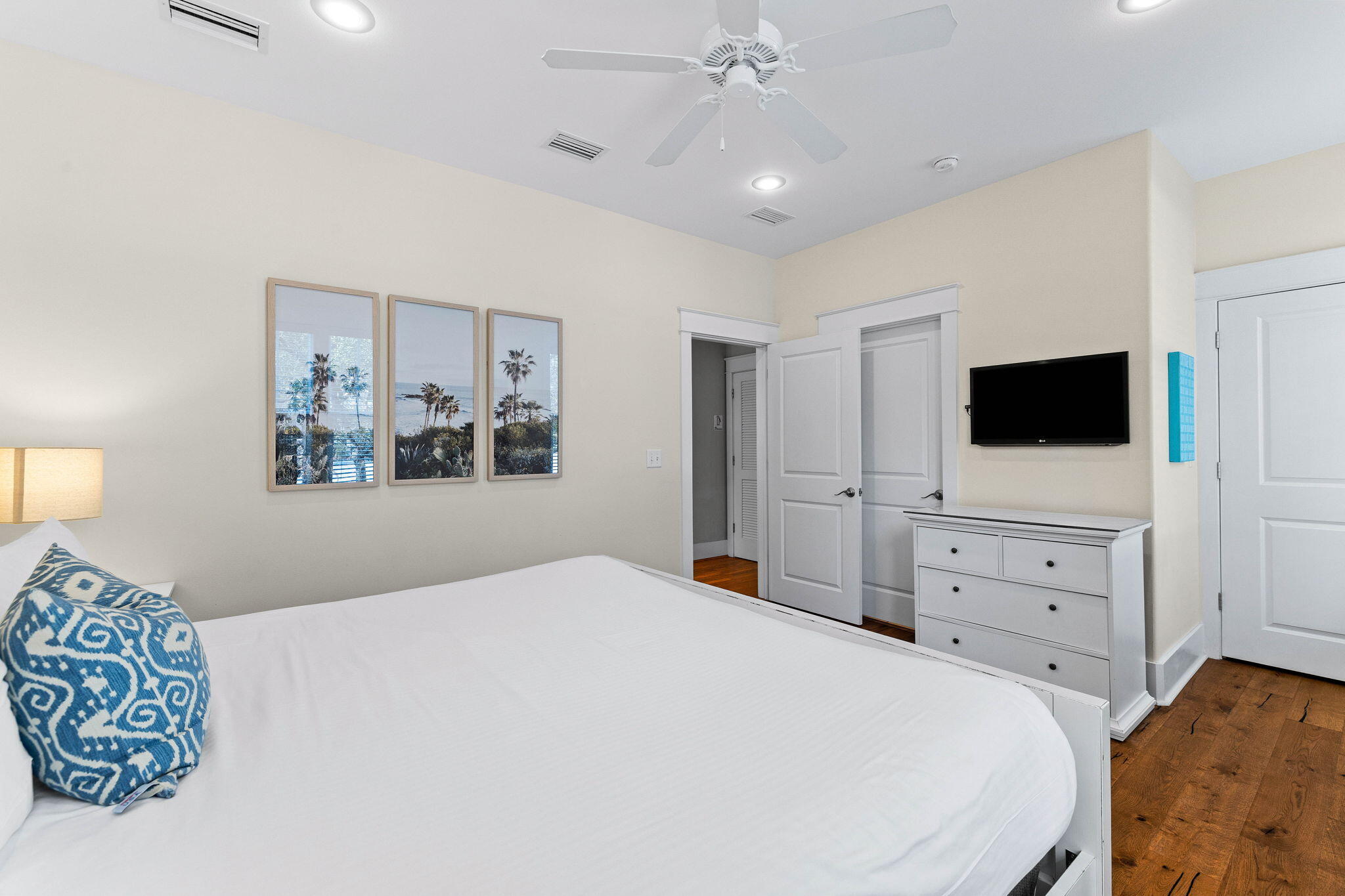 122 Sand Dunes Road Santa Rosa Beach, FL 32459 - Photo 32 of 72 a bedroom with a large bed and a flat tv screen on dresser