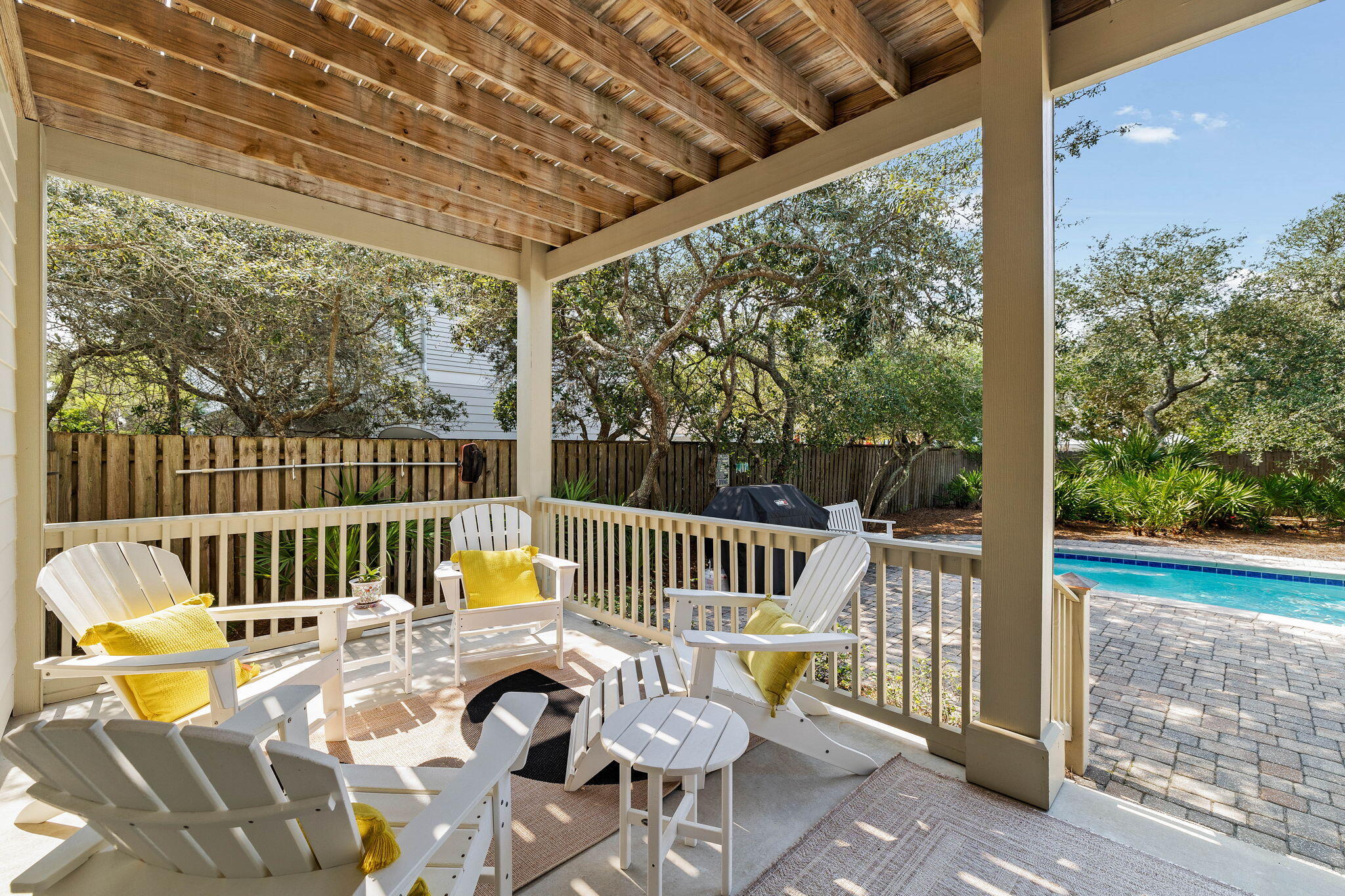 122 Sand Dunes Road Santa Rosa Beach, FL 32459 - Photo 34 of 72 a view of a patio with a table chairs and a patio