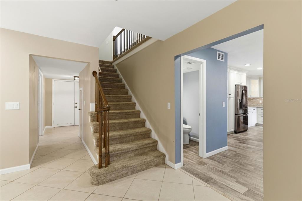 302 Bloomingfield Drive Brandon, FL 33511 - Photo 23 of 58 a view of a hallway with entryway and stairs