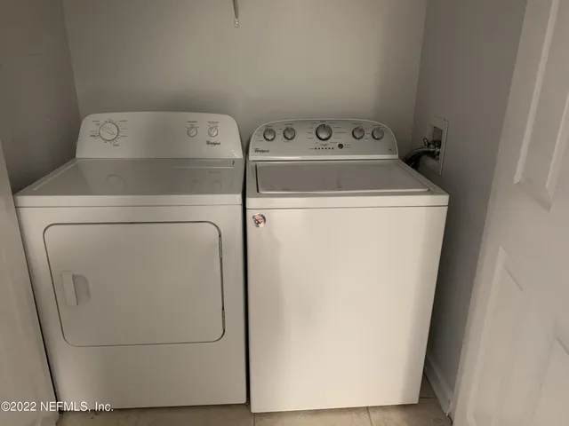 a utility room with dryer and washer