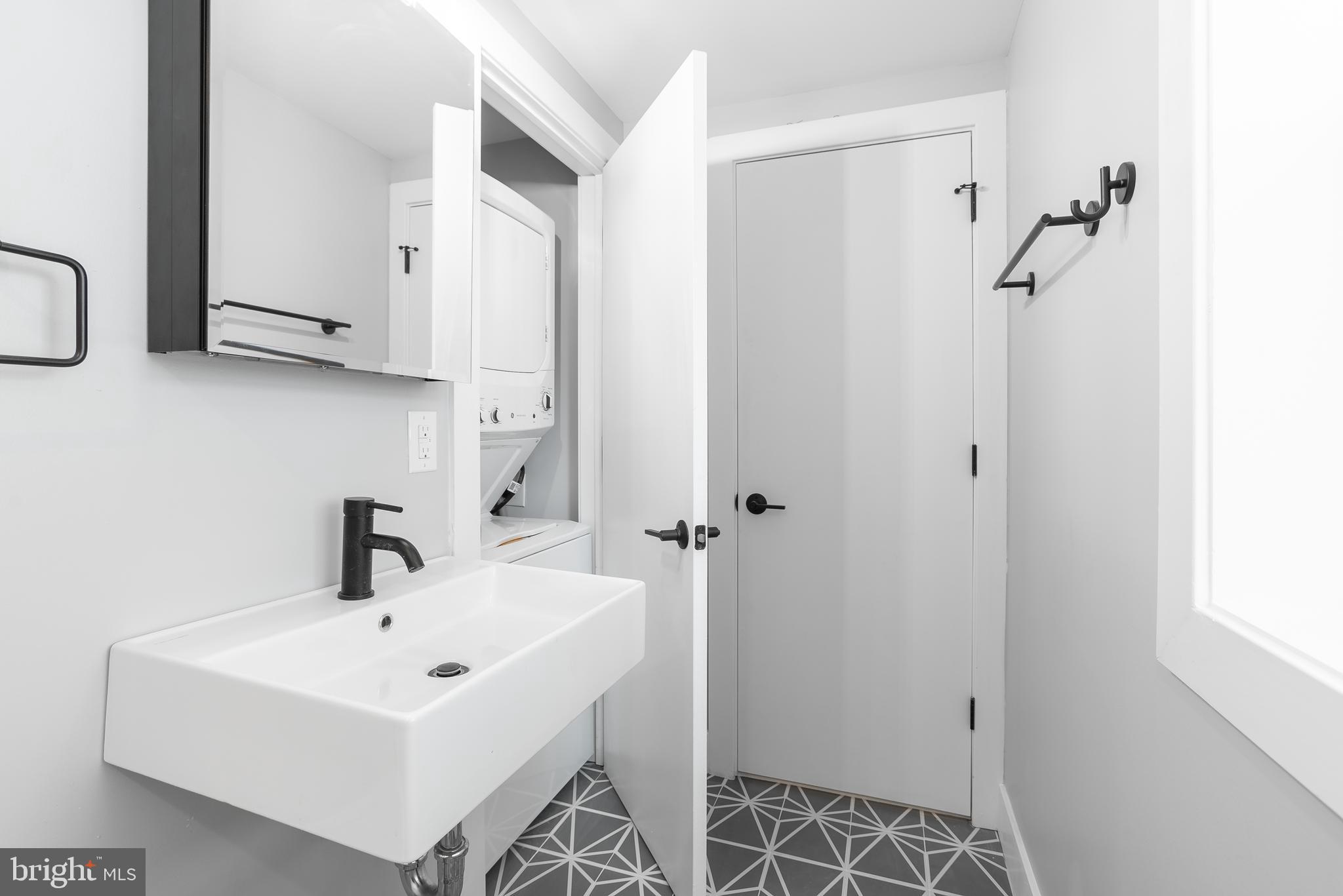 1707 Rittenhouse Square, Unit 3R Philadelphia, PA 19103 - Photo 11 of 13 a bathroom with a sink and a mirror