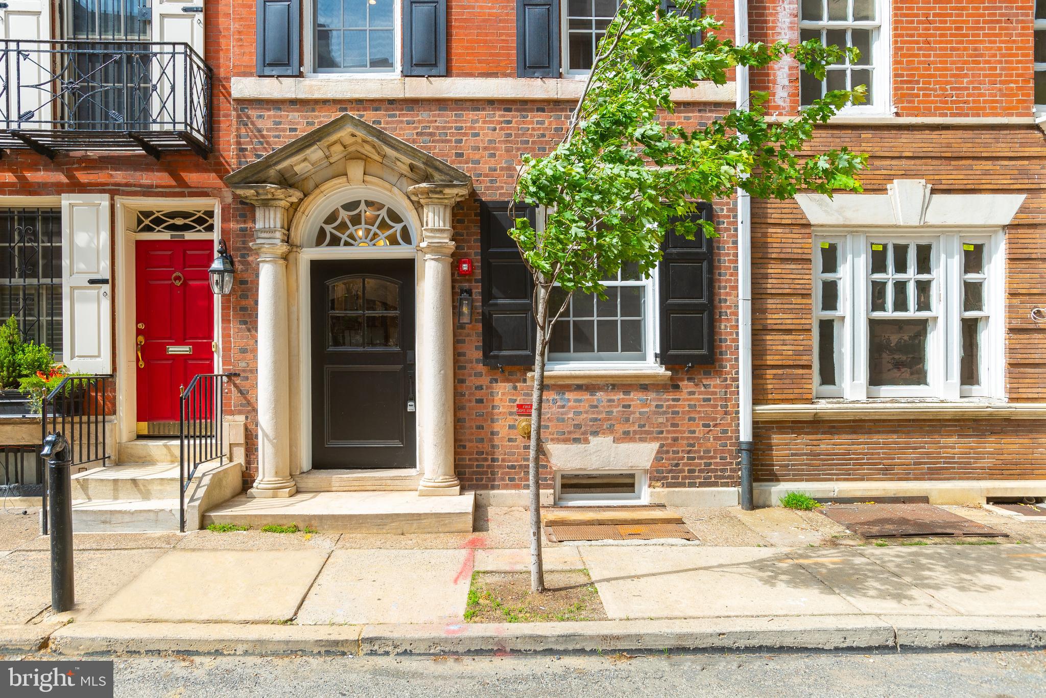 1707 Rittenhouse Square, Unit 3R Philadelphia, PA 19103 - Photo 12 of 13 a front view of a building with a garden and entryway