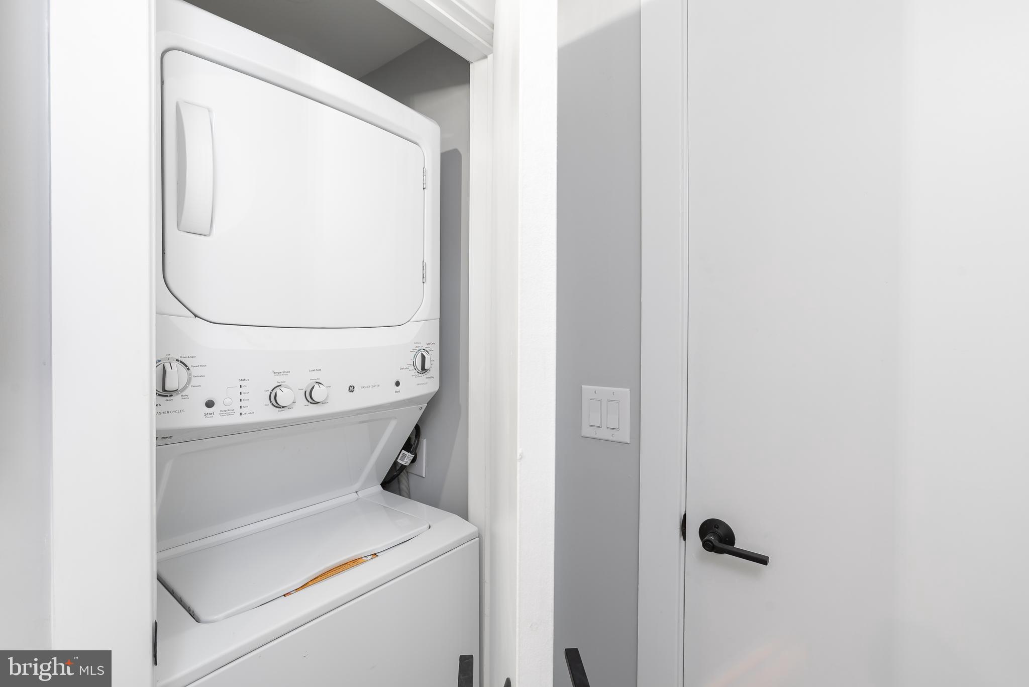 1707 Rittenhouse Square, Unit 3R Philadelphia, PA 19103 - Photo 10 of 13 a utility room with dryer and washer