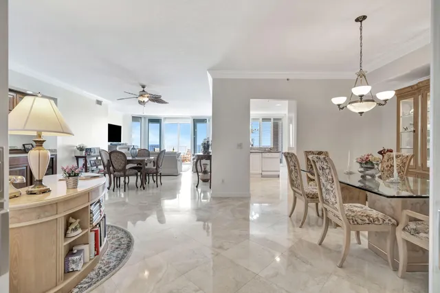 a view of a chairs and table in the balcony