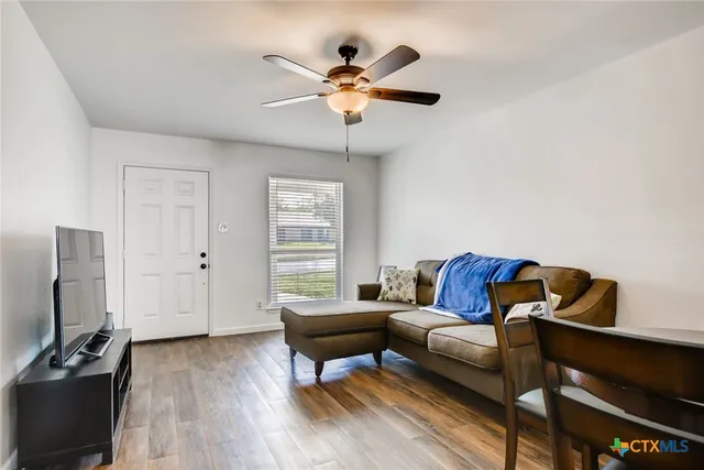 a living room with furniture and a window