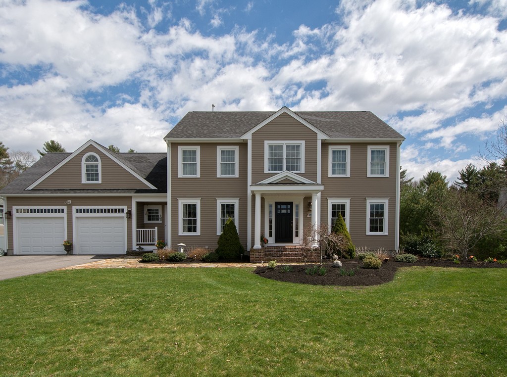 63 Saw Mill Road Duxbury, MA 02332 - Photo 1 of 29 a front view of a house with a garden and yard
