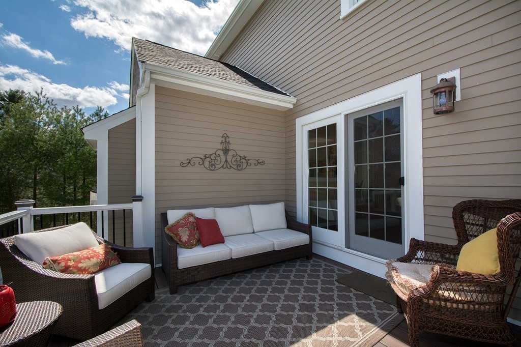 63 Saw Mill Road Duxbury, MA 02332 - Photo 11 of 29 a outdoor living space with patio furniture and a fireplace