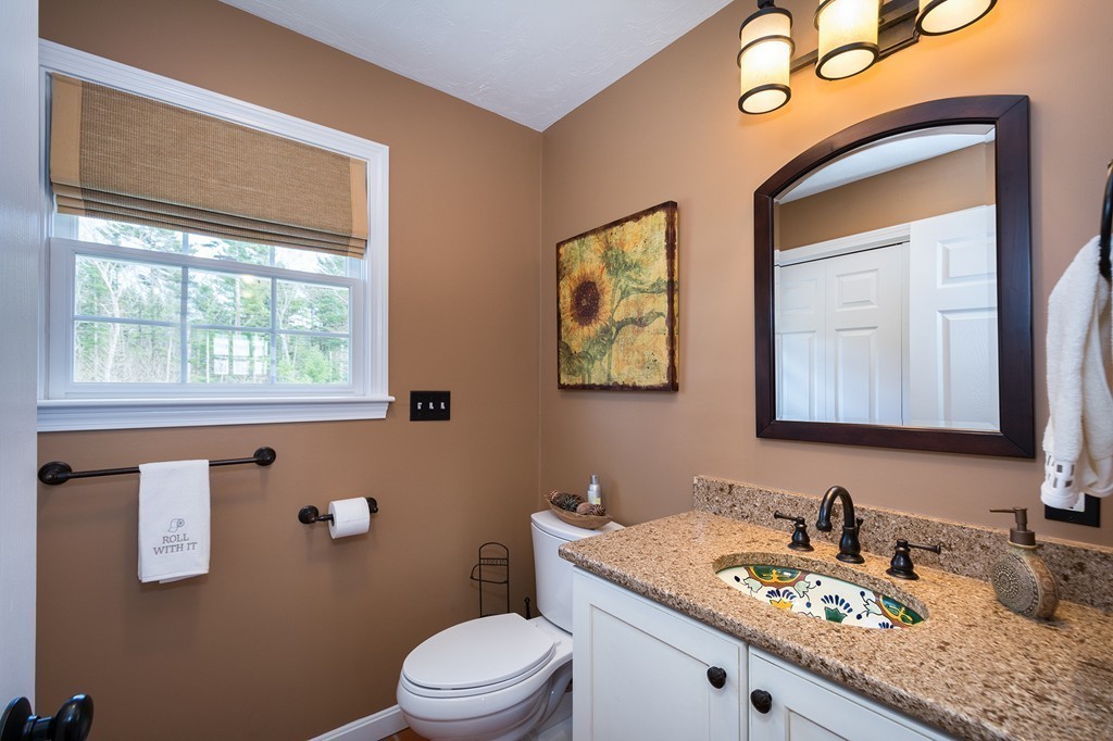 63 Saw Mill Road Duxbury, MA 02332 - Photo 16 of 29 a bathroom with a granite countertop sink mirror vanity and toilet