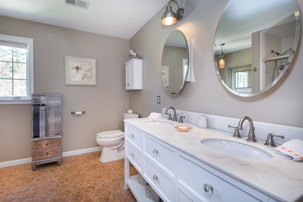 63 Saw Mill Road Duxbury, MA 02332 - Photo 19 of 29 a spacious bathroom with a double vanity sink toilet and a mirror