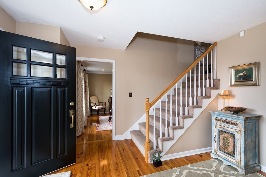 63 Saw Mill Road Duxbury, MA 02332 - Photo 2 of 29 a view of a hallway with wooden floor and staircase