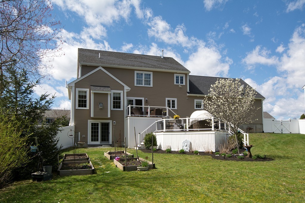 63 Saw Mill Road Duxbury, MA 02332 - Photo 28 of 29 a front view of a house with a yard