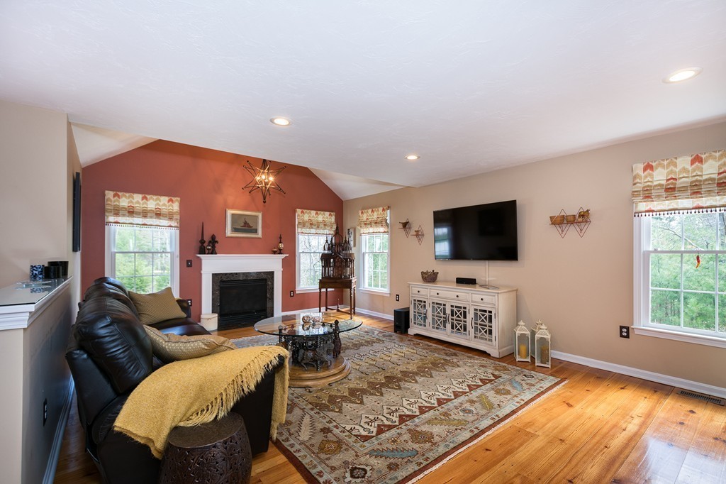 63 Saw Mill Road Duxbury, MA 02332 - Photo 6 of 29 a living room with furniture fireplace and a flat screen tv