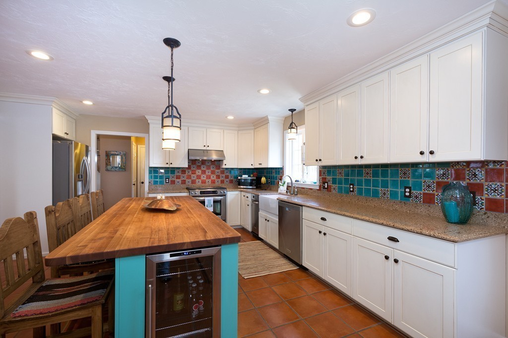 63 Saw Mill Road Duxbury, MA 02332 - Photo 9 of 29 a kitchen with stainless steel appliances granite countertop a sink a stove and cabinets