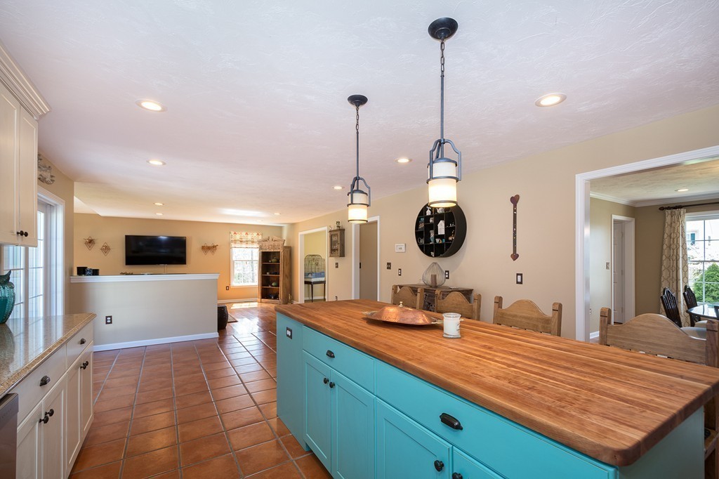 63 Saw Mill Road Duxbury, MA 02332 - Photo 10 of 29 a large kitchen with kitchen island granite countertop a sink and a white cabinets