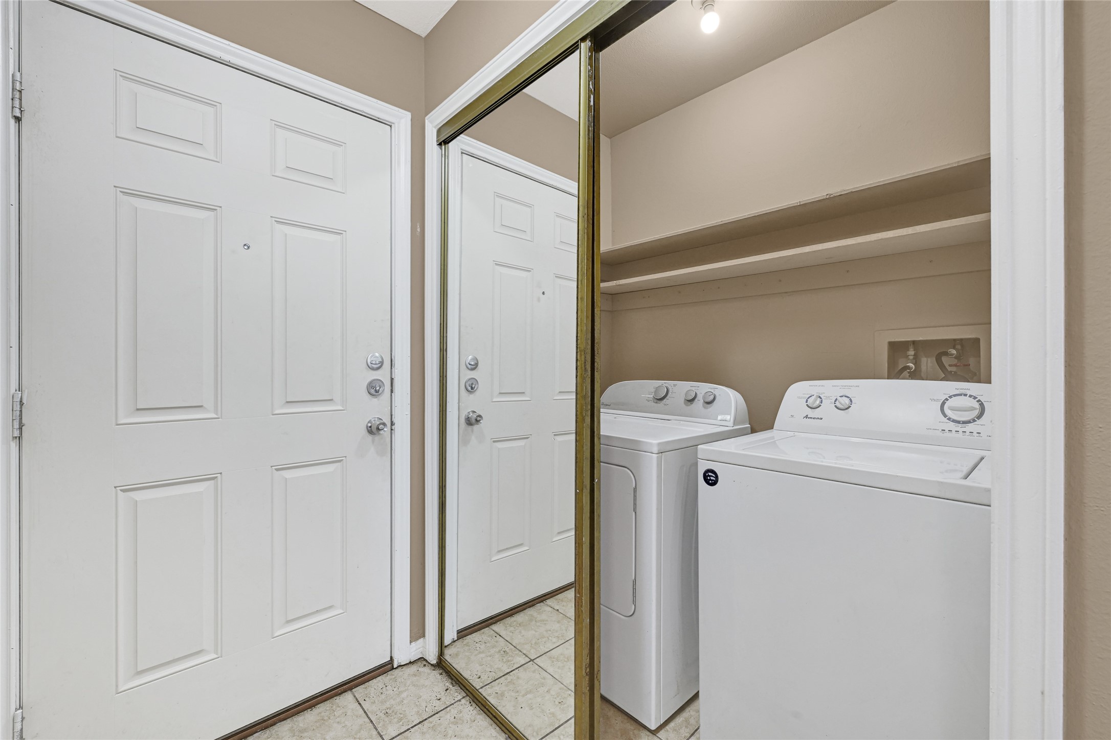 2030 Plantation Drive, Unit B14 Conroe, TX 77301 - Photo 14 of 19 a utility room with dryer and washer