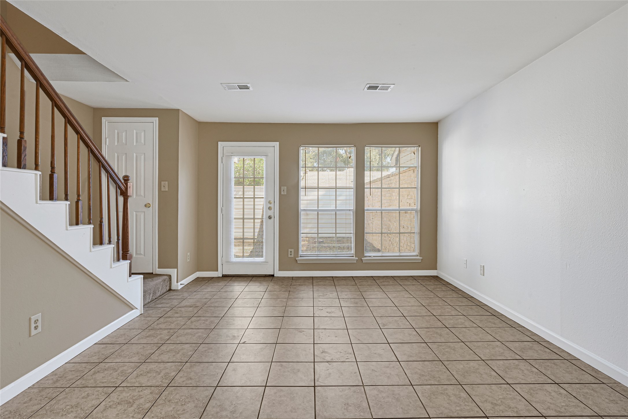 2030 Plantation Drive, Unit B14 Conroe, TX 77301 - Photo 3 of 19 a view of an empty room with window