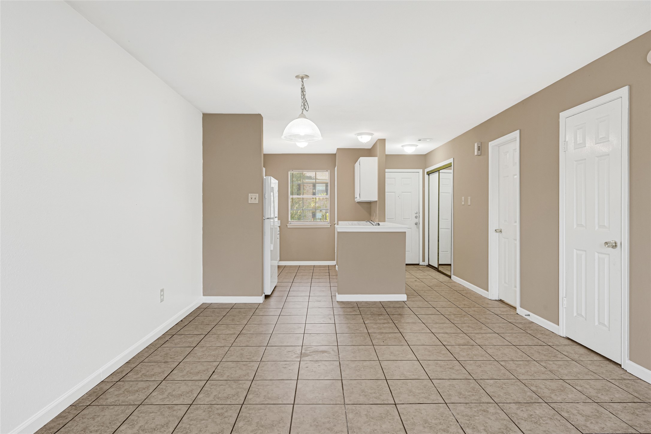 2030 Plantation Drive, Unit B14 Conroe, TX 77301 - Photo 6 of 19 a view of a kitchen with a sink and a microwave