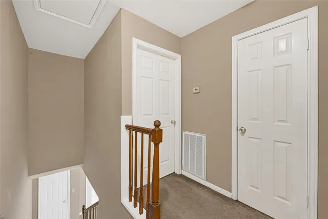 a view of a hallway with a door