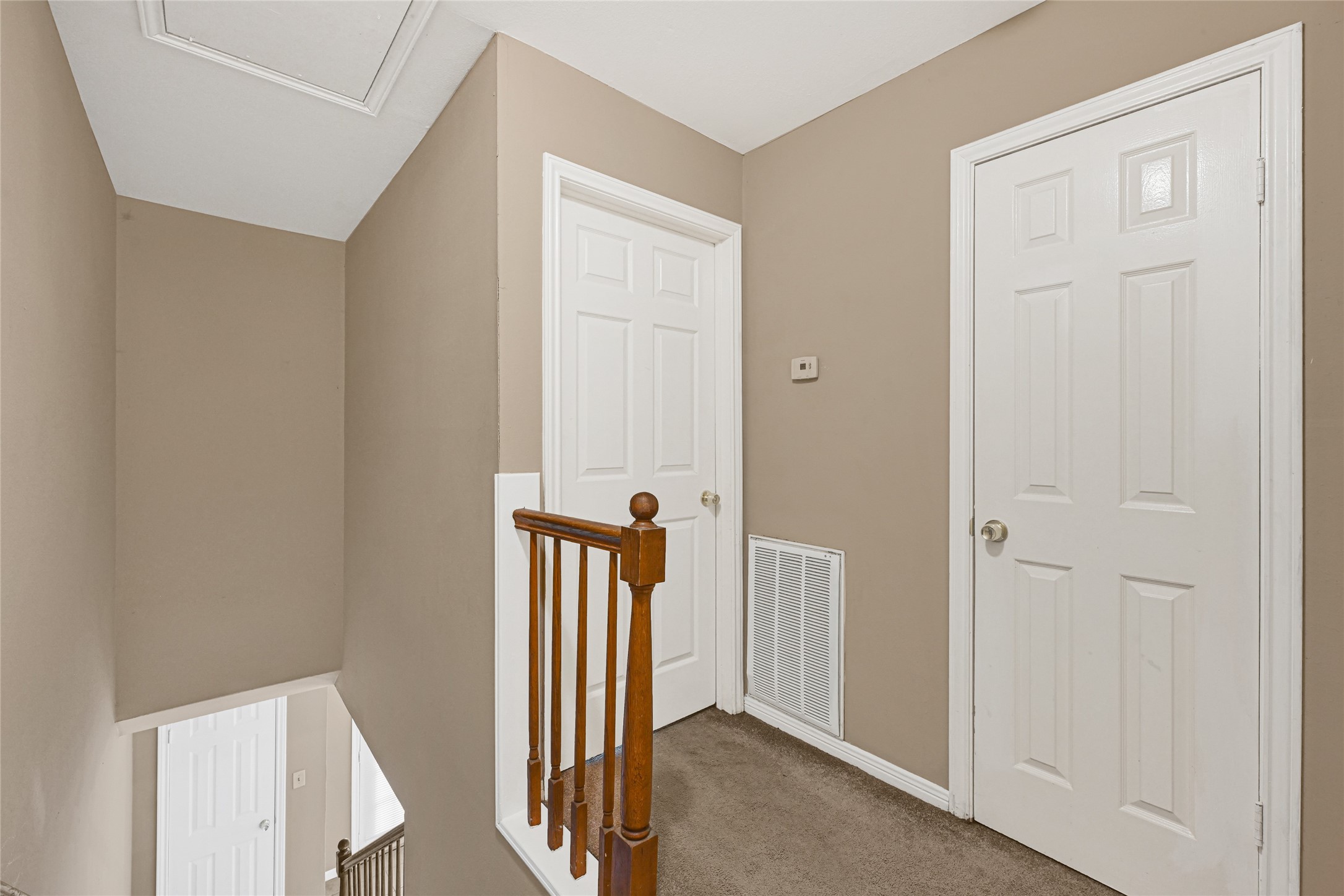 2030 Plantation Drive, Unit B14 Conroe, TX 77301 - Photo 10 of 19 a view of a hallway with a door