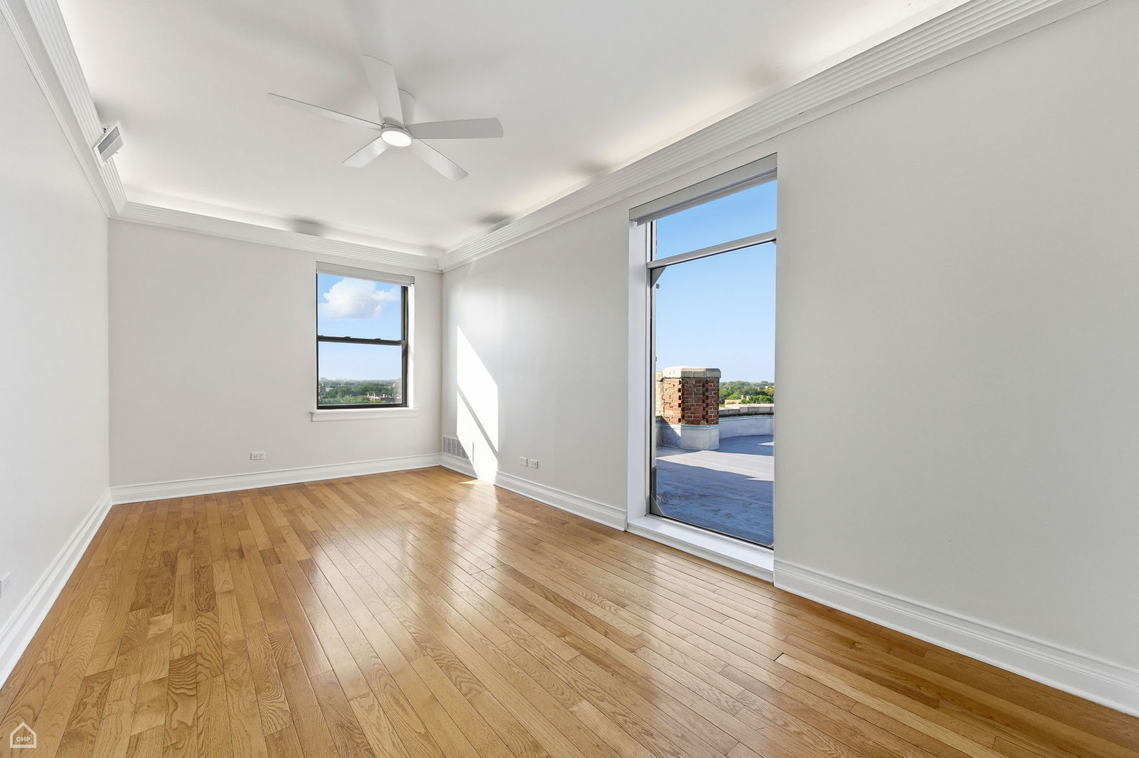 7301 North Sheridan Road, Unit 901 Chicago, IL 60626 - Photo 13 of 18 wooden floor in an empty room with a window