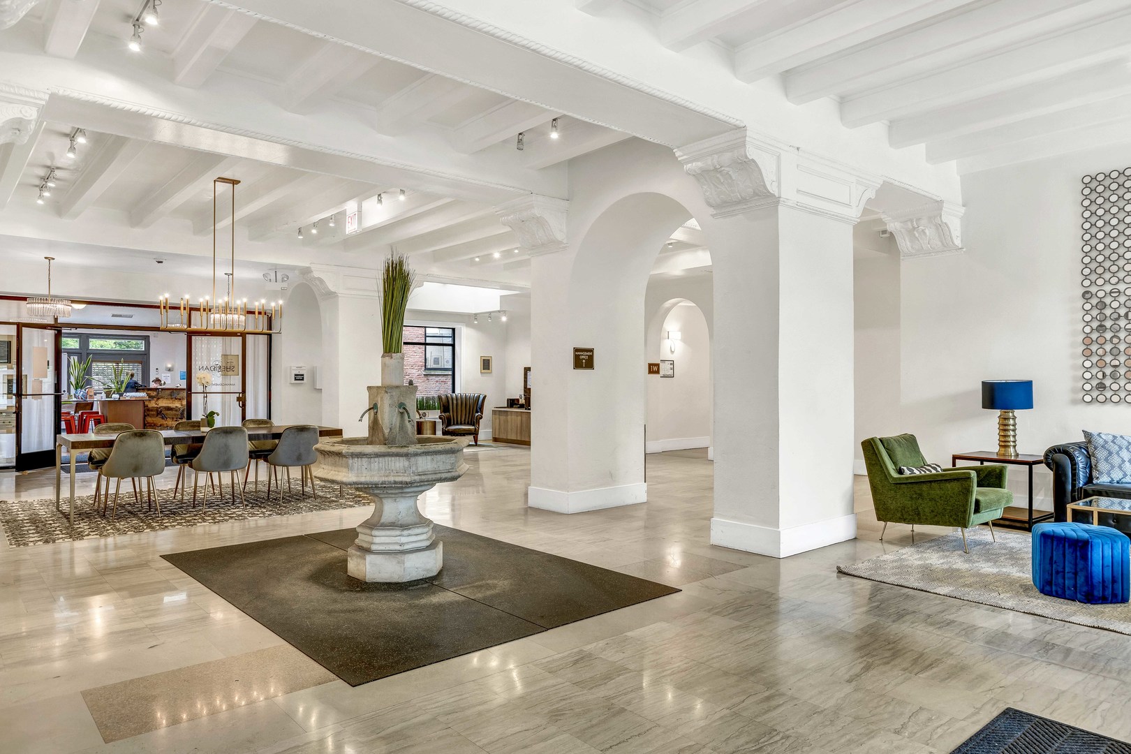 7301 North Sheridan Road, Unit 901 Chicago, IL 60626 - Photo 15 of 18 a living room with lots of furniture and a chandelier