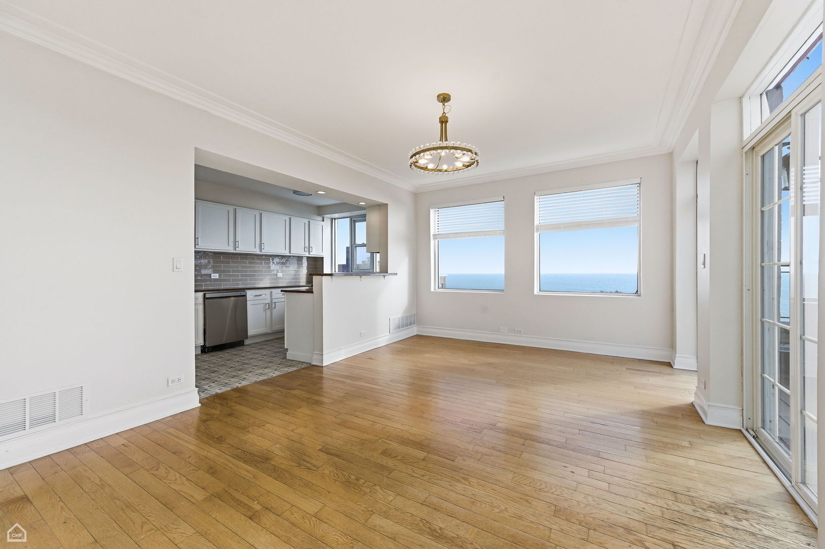 7301 North Sheridan Road, Unit 901 Chicago, IL 60626 - Photo 2 of 18 a view of empty room with wooden floor and window