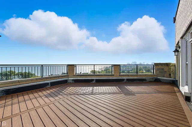 a view of a balcony with wooden floor