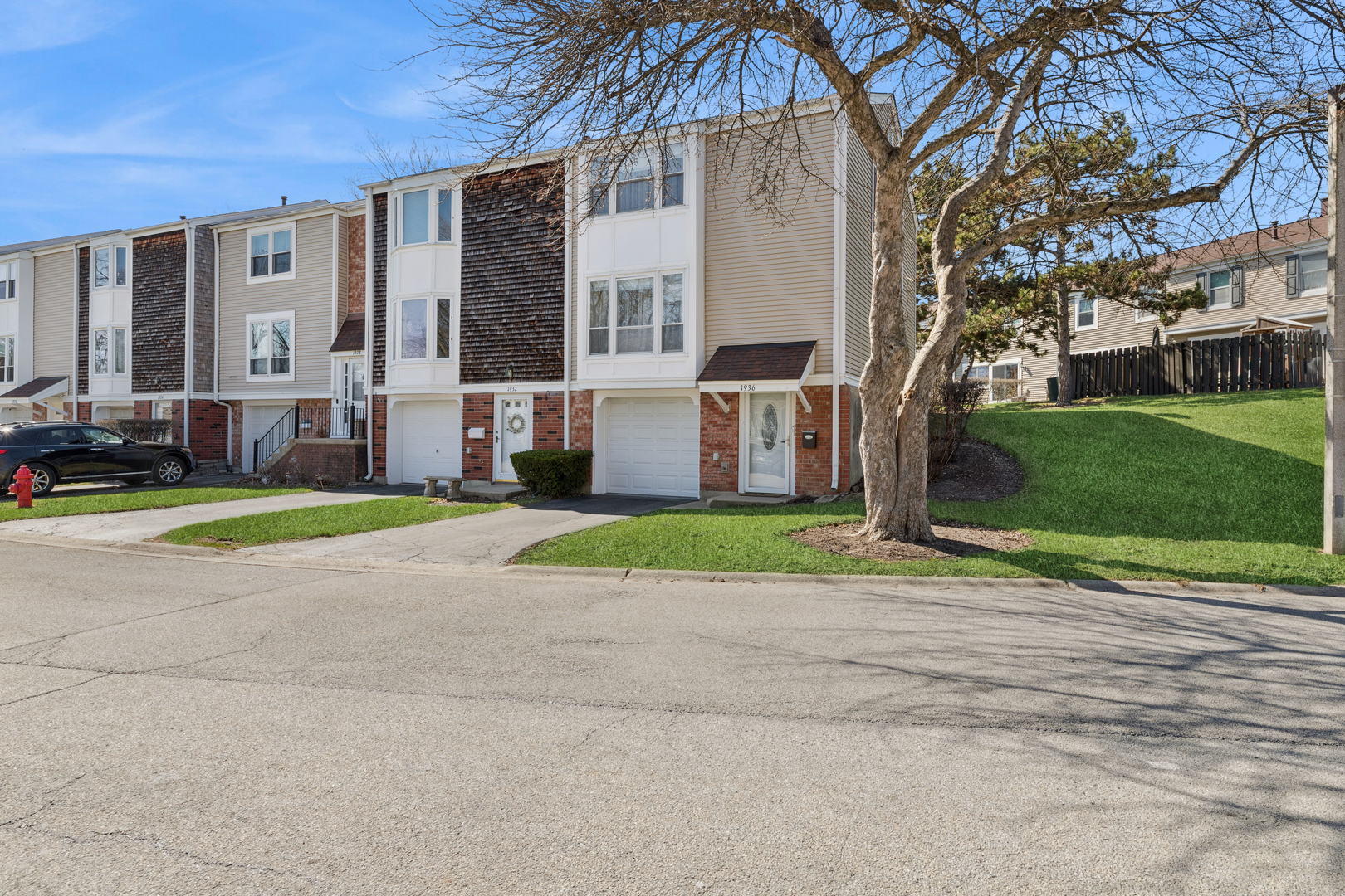1936 Whitingham Lane Hoffman Estates, IL 60169 - Photo 1 of 23 a view of a house with a yard and large tree