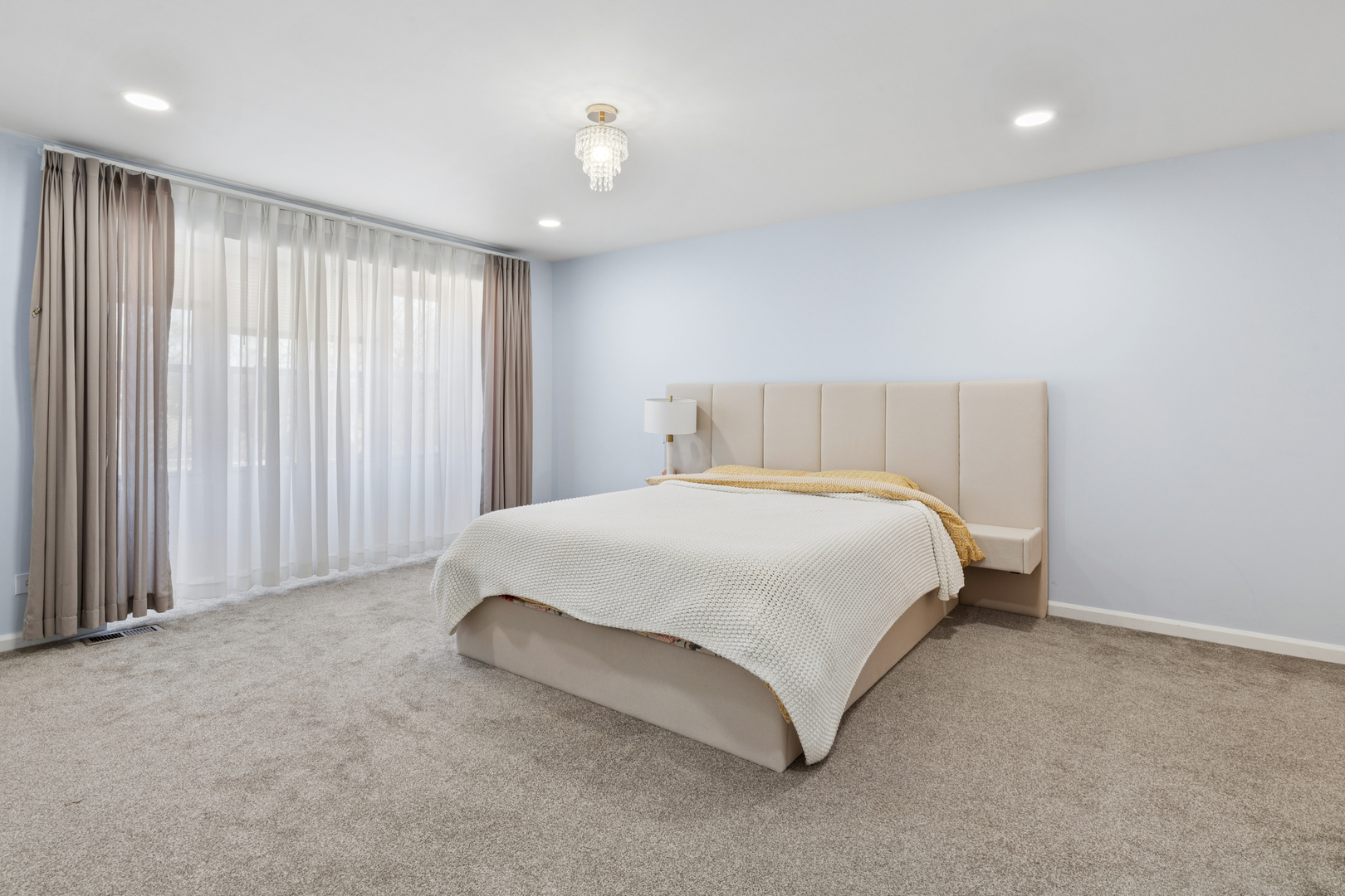 1936 Whitingham Lane Hoffman Estates, IL 60169 - Photo 13 of 23 a spacious bedroom with a bed and a view