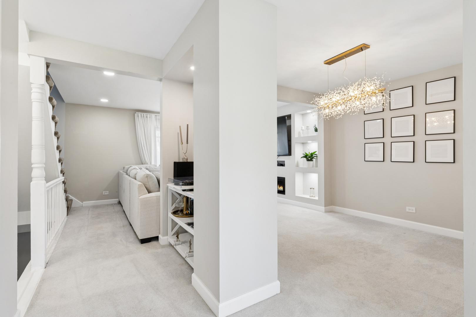 1936 Whitingham Lane Hoffman Estates, IL 60169 - Photo 18 of 23 a living room with furniture and a chandelier