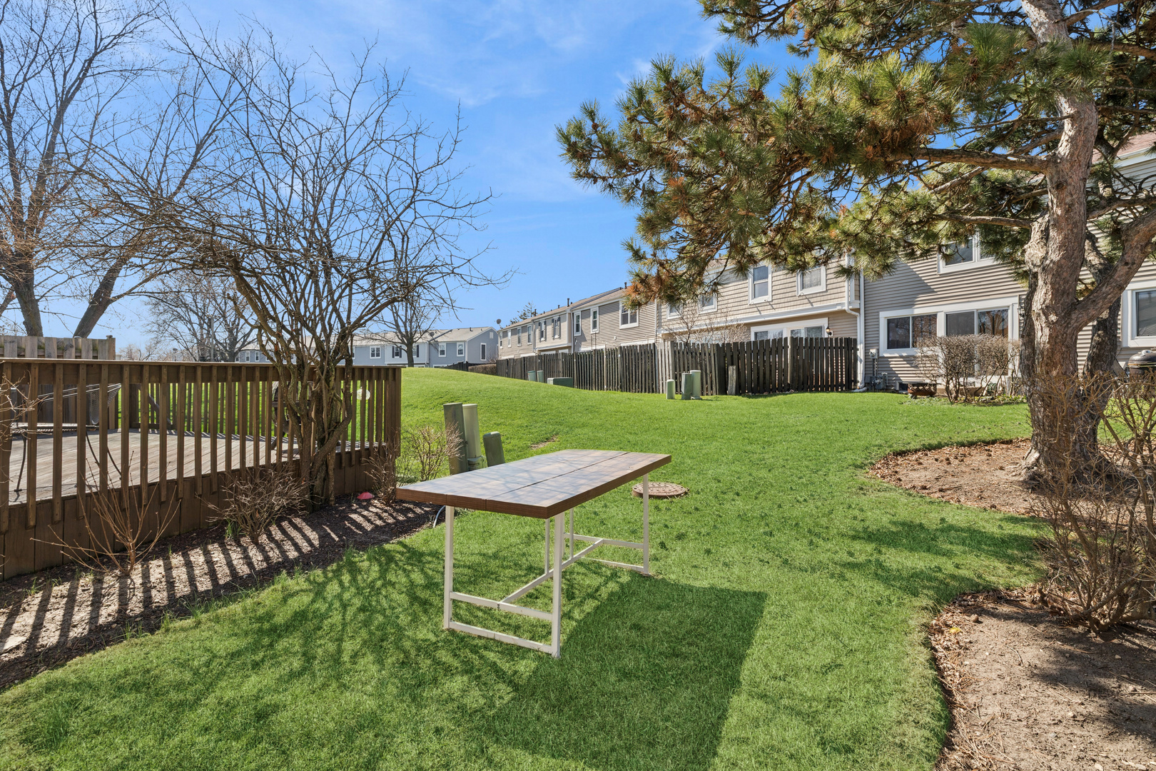 1936 Whitingham Lane Hoffman Estates, IL 60169 - Photo 19 of 23 a view of a chair and table in backyard of the house
