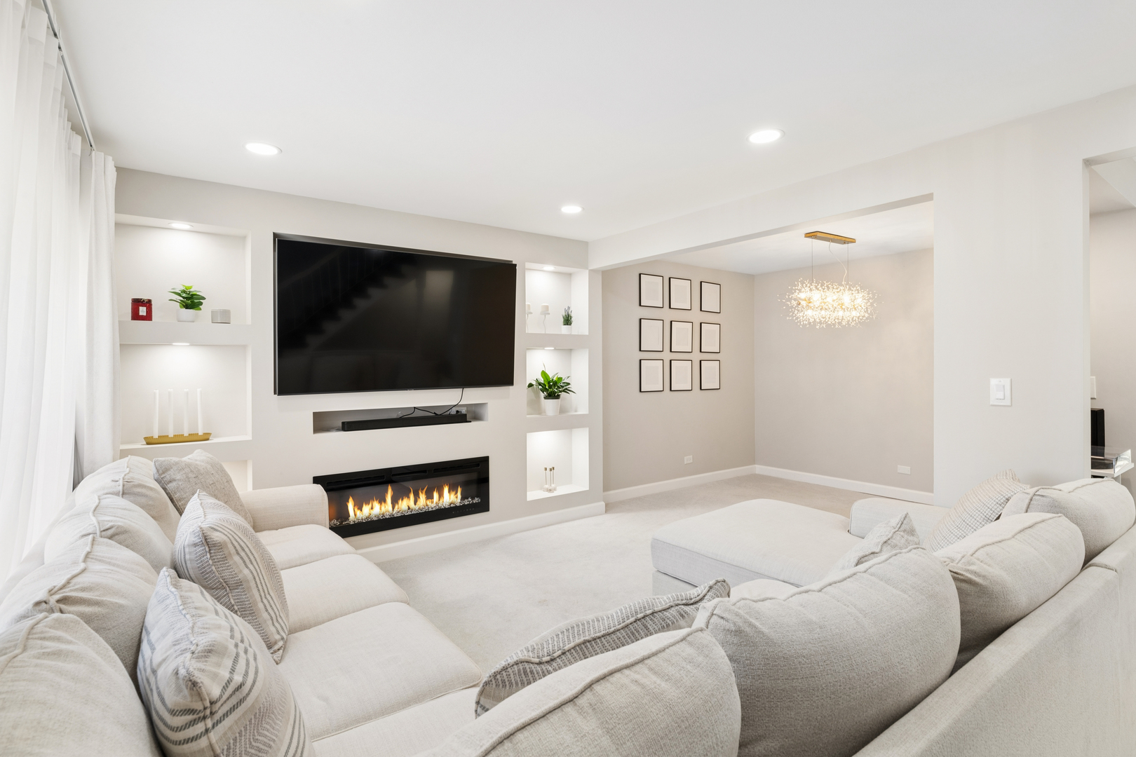 1936 Whitingham Lane Hoffman Estates, IL 60169 - Photo 5 of 23 a living room with furniture a flat screen tv and a fireplace