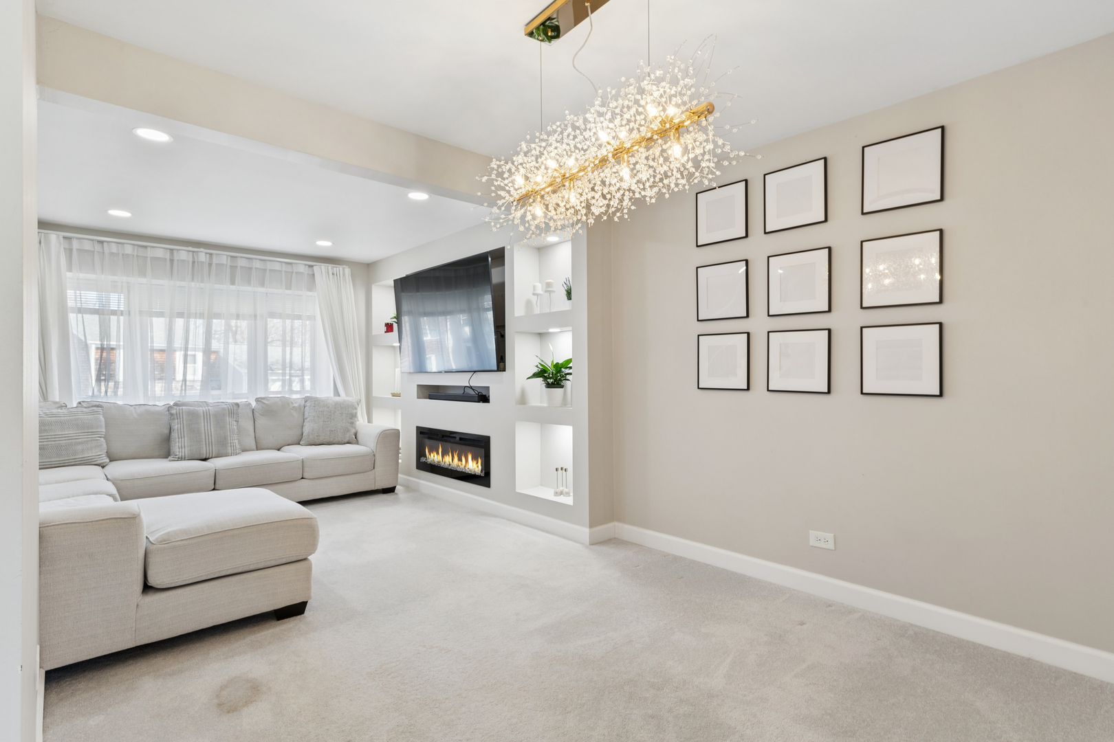 1936 Whitingham Lane Hoffman Estates, IL 60169 - Photo 6 of 23 a living room with furniture and a chandelier