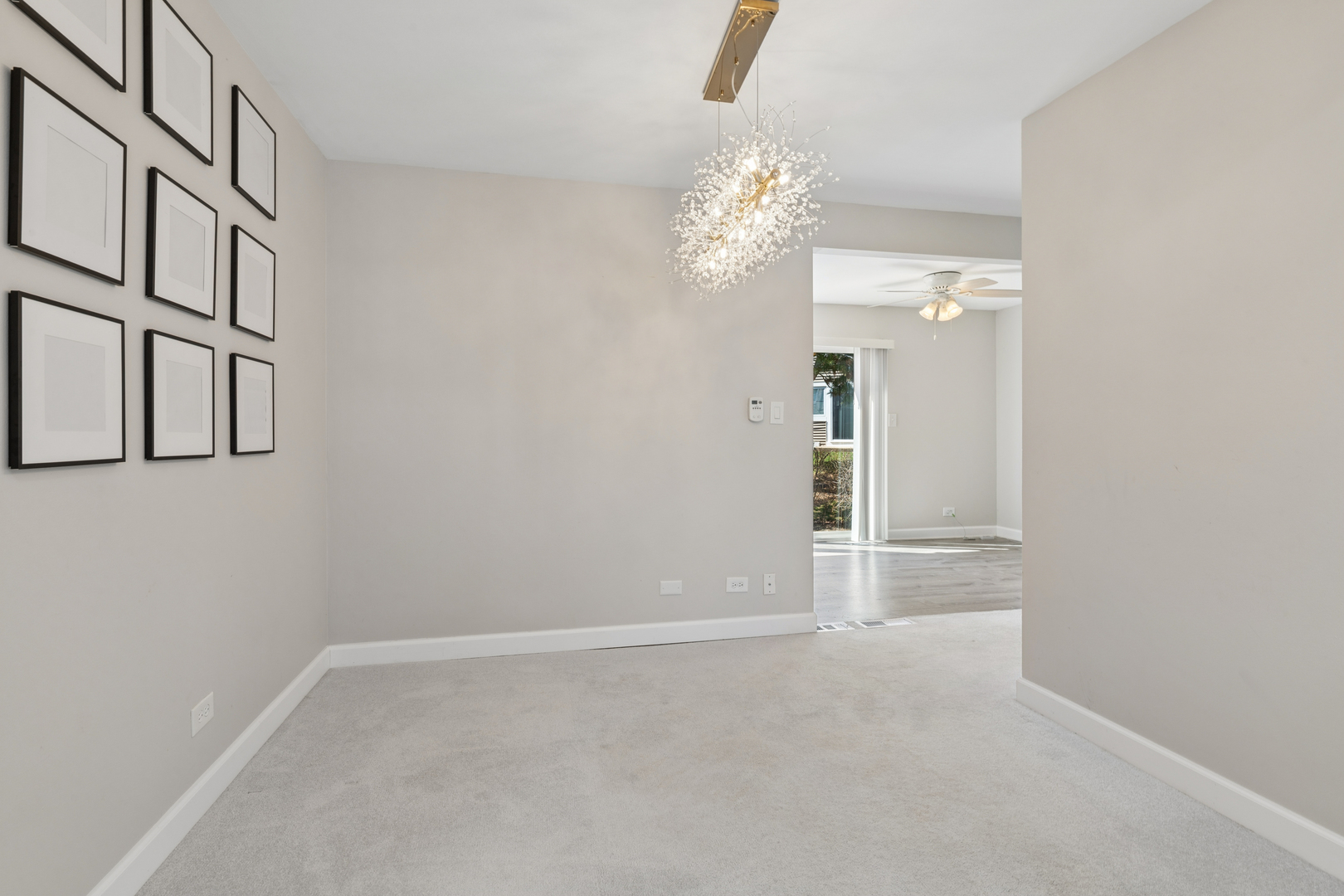 1936 Whitingham Lane Hoffman Estates, IL 60169 - Photo 7 of 23 wooden floor in an empty room with a window