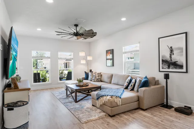 a living room with furniture and a large window