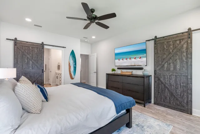 a bedroom with a large bed and a window