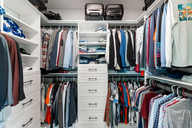 a bedroom with a bed and a mirror