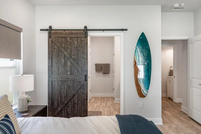 a bathroom with a double vanity sink mirror and shower