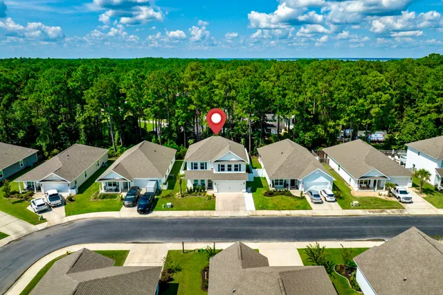 a view of houses with yard
