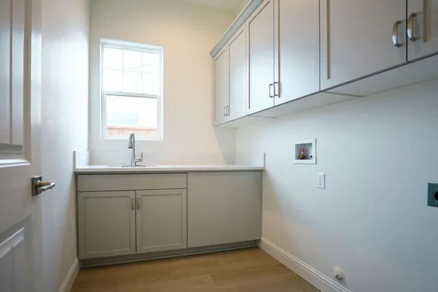 a bathroom with a sink and a window