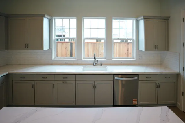 a bathroom with a sink and a window