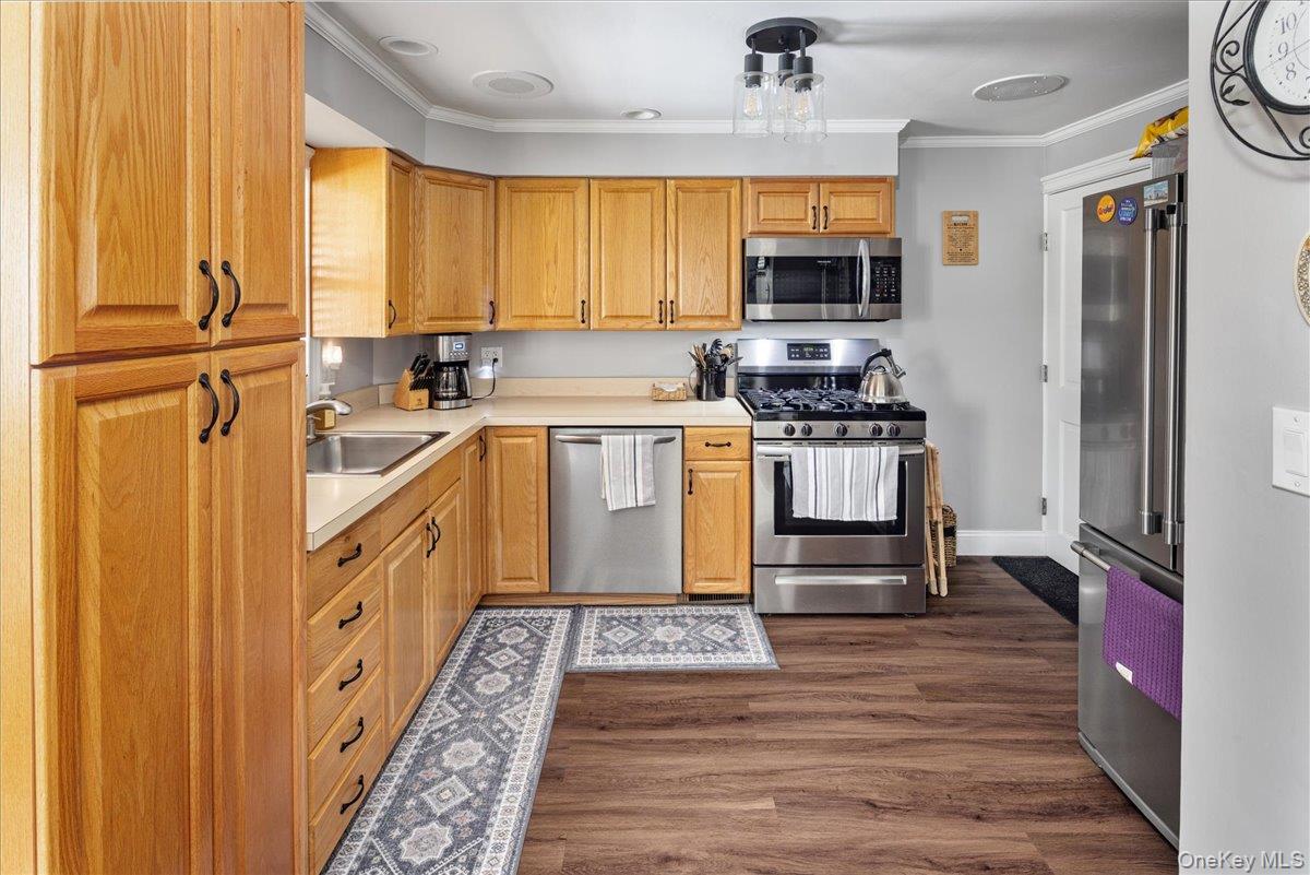 170 Birch Hill Road Locust Valley, NY 11560 - Photo 13 of 38 a kitchen with stainless steel appliances granite countertop a refrigerator a stove top oven a sink and dishwasher