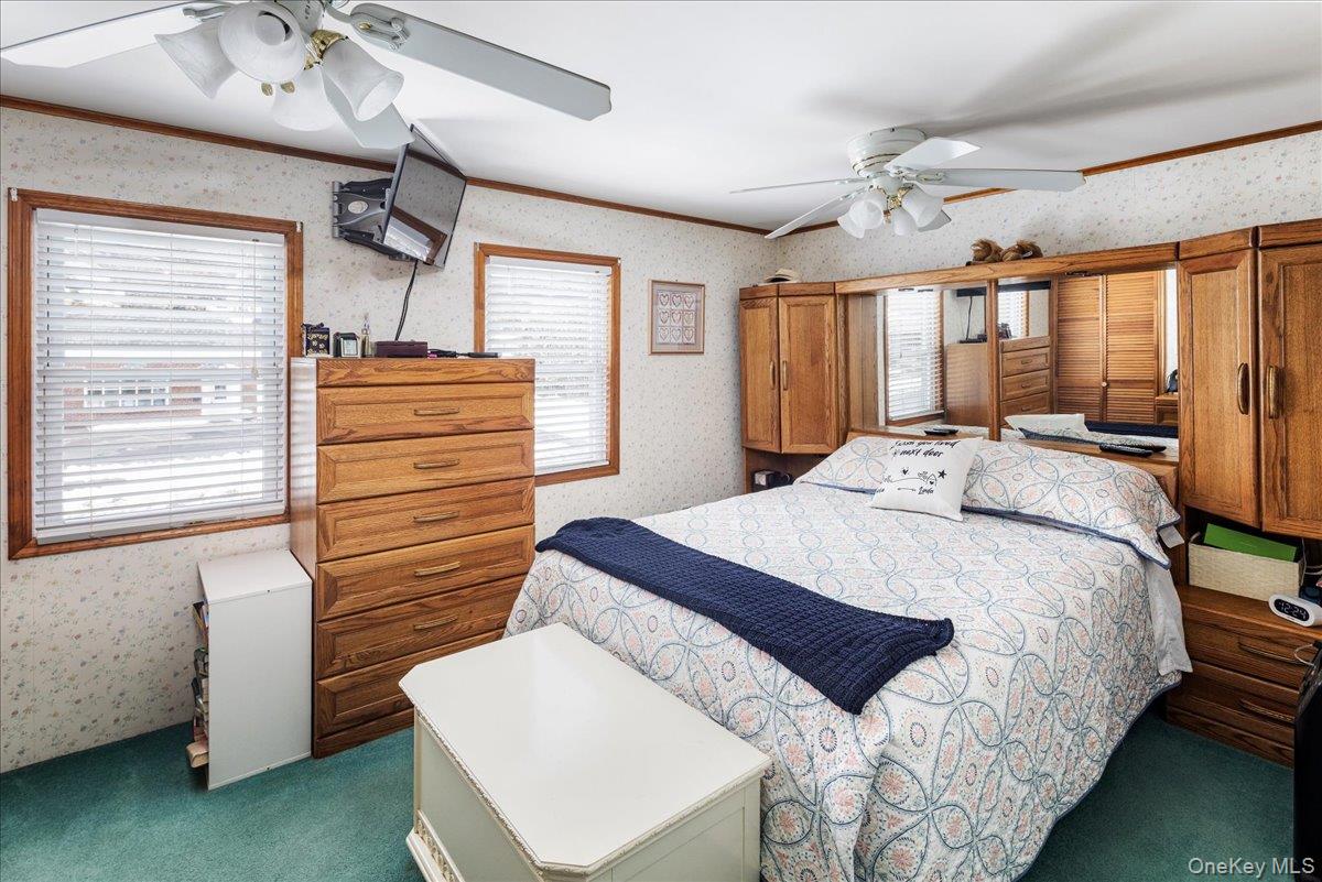 170 Birch Hill Road Locust Valley, NY 11560 - Photo 15 of 38 a bedroom with a bed and a table