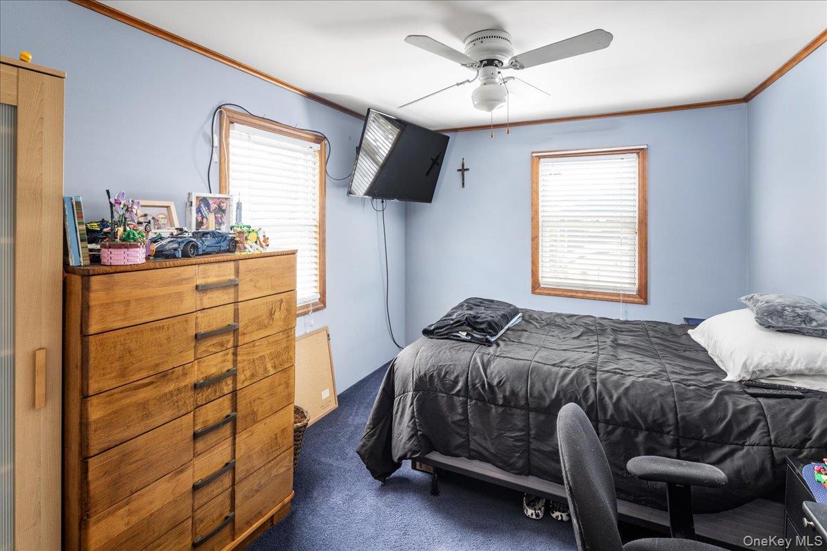 170 Birch Hill Road Locust Valley, NY 11560 - Photo 16 of 38 a bedroom with a bed and a dresser
