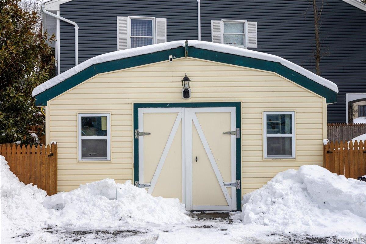 170 Birch Hill Road Locust Valley, NY 11560 - Photo 23 of 38 a front view of a house with a yard