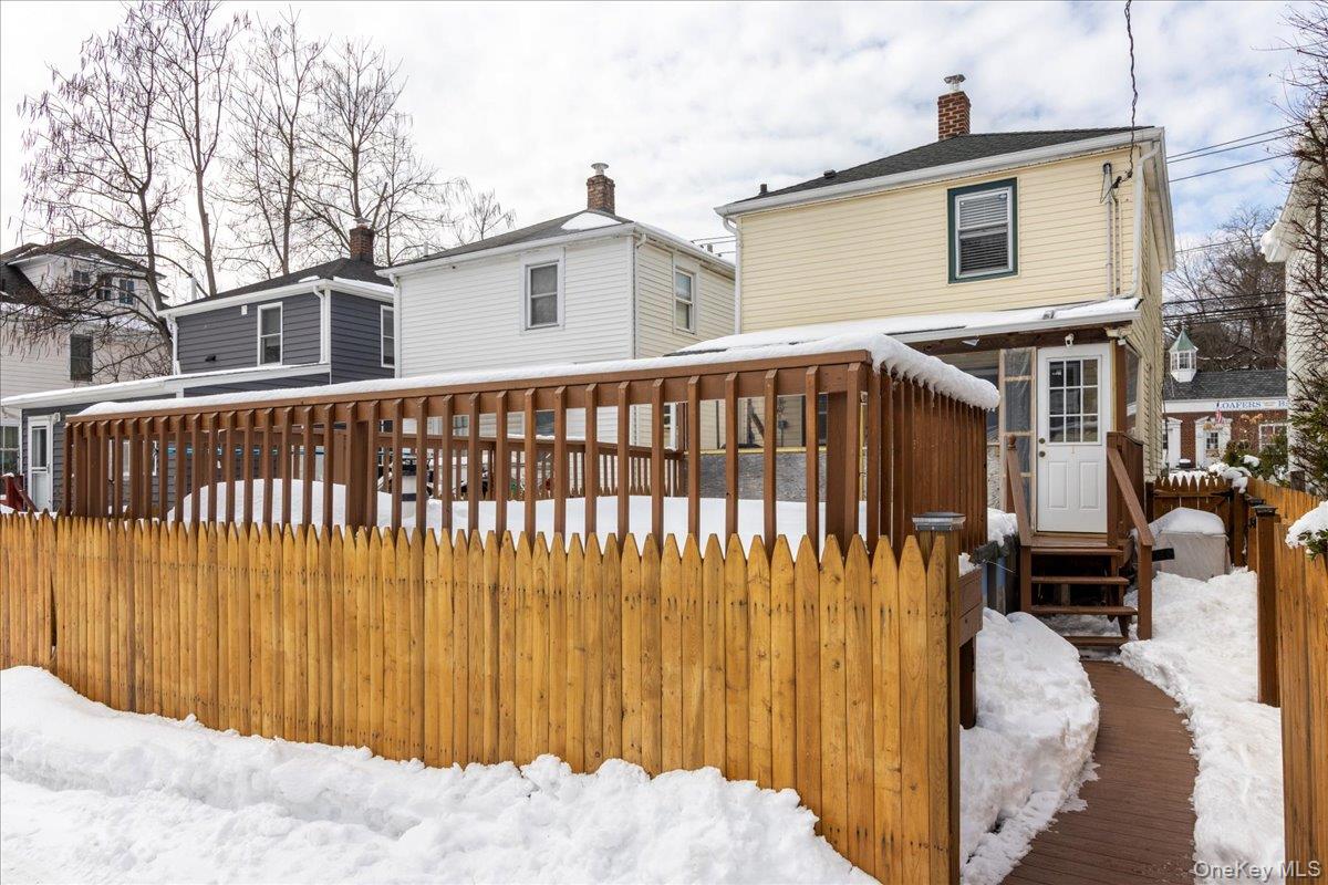 170 Birch Hill Road Locust Valley, NY 11560 - Photo 24 of 38 a view of a house with a wooden fence