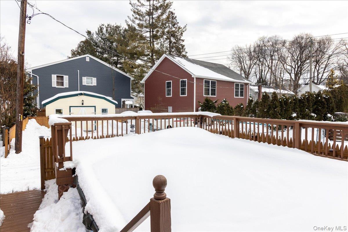 170 Birch Hill Road Locust Valley, NY 11560 - Photo 27 of 38 a view of a house with a small yard and wooden fence