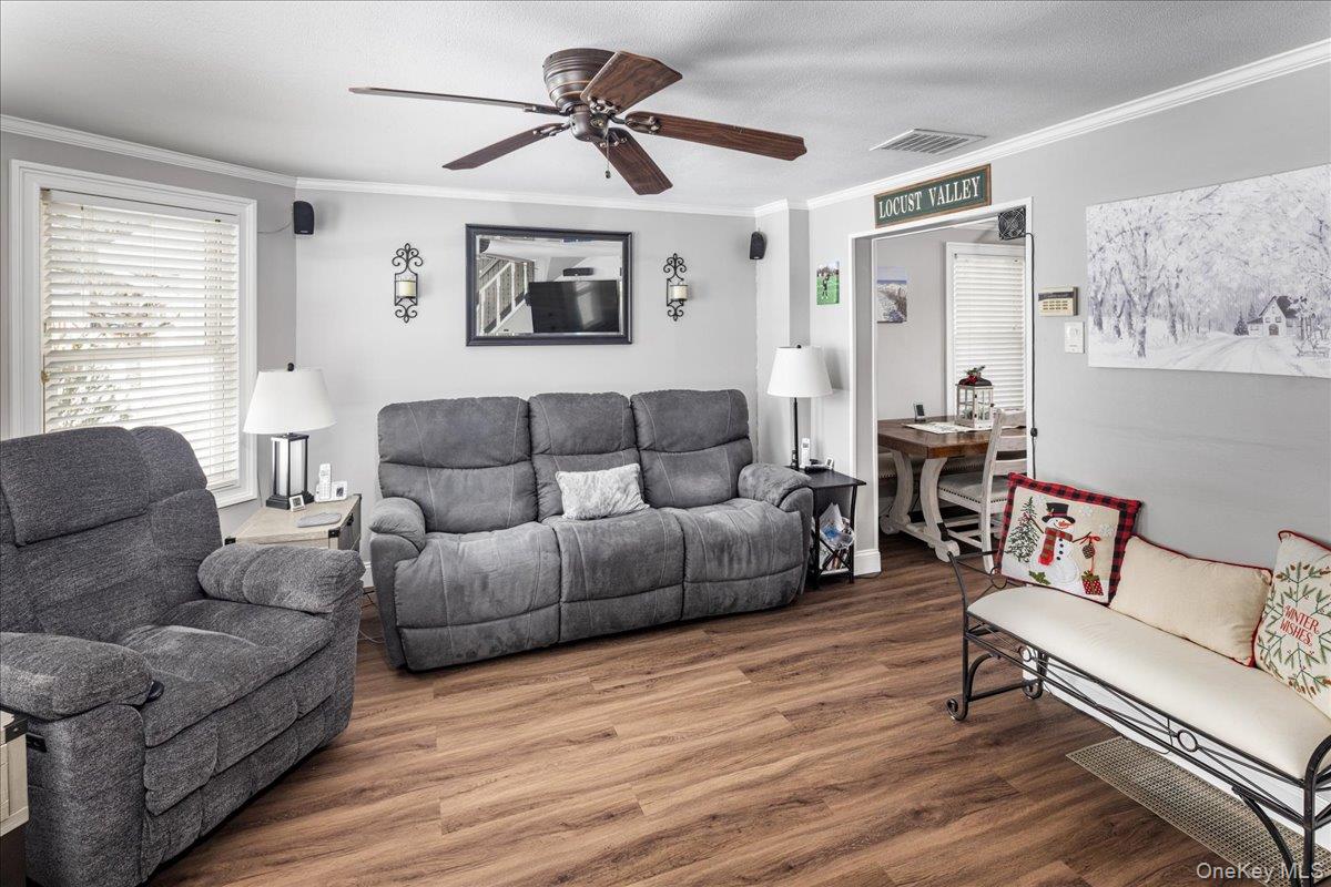 170 Birch Hill Road Locust Valley, NY 11560 - Photo 8 of 38 a living room with furniture and a wooden floor