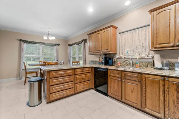 a kitchen with sink cabinets and window